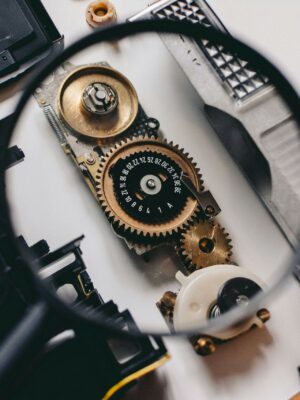 Photo by Shane Aldendorff Intricate gears of a camera mechanism magnified, showcasing mechanical precision.